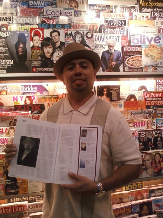 Posing with World Literature Today Magazine Article about Barrio Bushido
